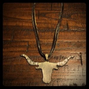 Necklace with longhorn detail.